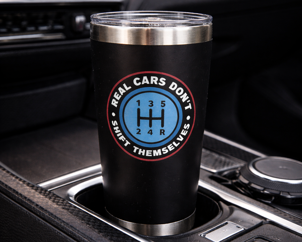 Black tumbler with a blue and red logo in a car's cup holder.