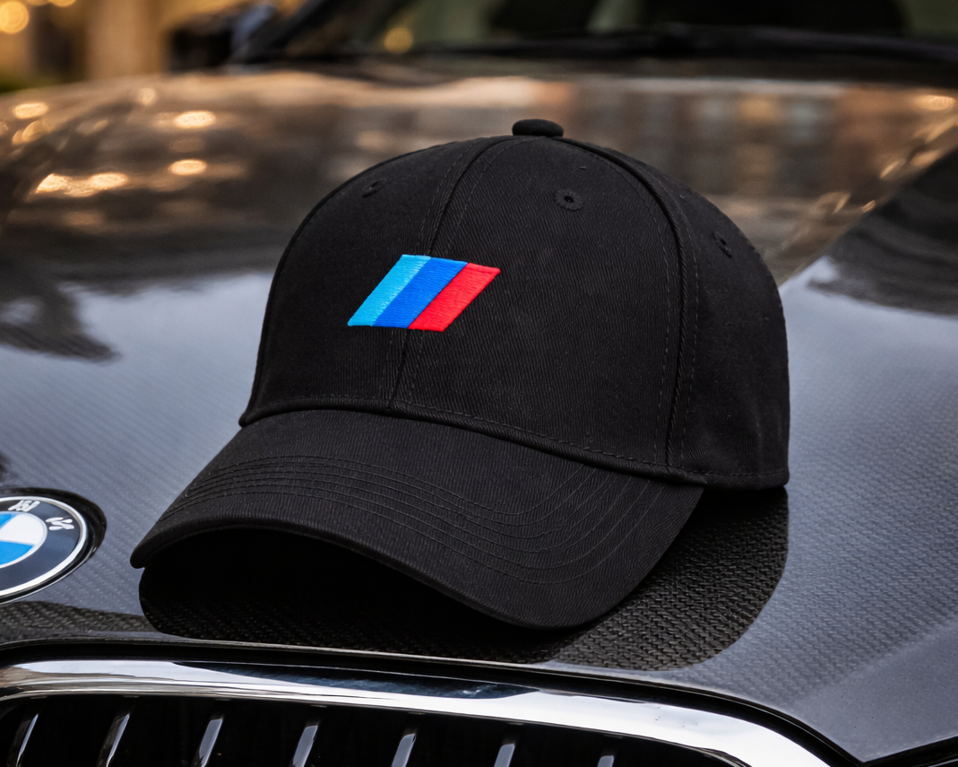 Black cap with colorful logo on a BMW car